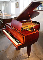 A 1955, Yamaha No20 grand piano with a satin, mahogany case. Piano features unusual, angular case styling. Piano lyre rests on a single rod. A rare chance to own a collectable, vintage Yamaha.
