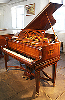 Artcase, Schiedmayer grand piano for sale with a satinwood case. Cabinet features crossbanding and boxwood stringing accents and is hand painted in romanesque designs with cherubs, soldiers and dancing ladies. Piano has gate legs and an elegant serpentine cross stretcher.