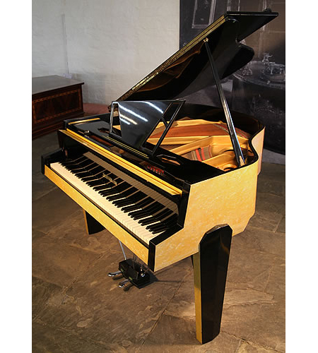Reconditioned, 1950's Zimmermann baby grand piano for sale with a contrasting yellow and black formica case