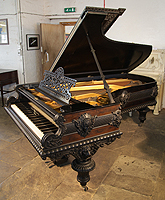 An 1883, Artcase, Bechstein Model C Grand Piano For Sale with a Pear and Ebony Case. Entire Cabinet Features Ornate Carvings of Female Figureheads, Lions and Arabesques