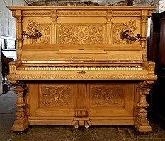 Hupfer upright piano with a classical style oak case
