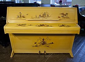 A Monington and Weston upright piano with a lime case, covered in Chinese painting