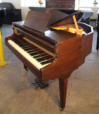 Squire butterfly baby grand piano