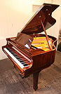 Piano for sale. A brand new Steinhoven GP160 grand piano with a walnut case and polyester finish.