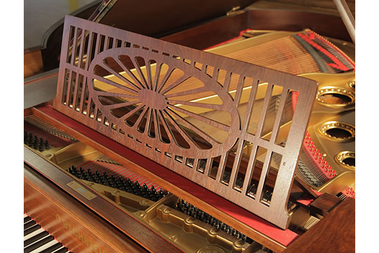 Bechstein piano music desk in a slatted openwork design with central sunburst motif