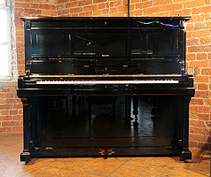 A restored, 1891, Steinway Model K upright piano with a black case