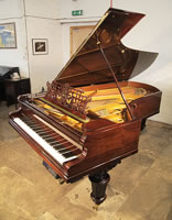 An Antique, Bechstein Model D grand piano with a polished, rosewood case, filigree music desk and turned legs. Piano Has a fitted PianoDisc Symphony Pro 228 CFX system. 