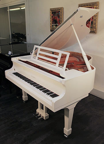 A brand new, Feurich Model 161 Professional grand piano with a white case and chrome fittings. 