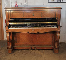 An 1854, Pleyel upright piano with a quartered, rosewood case. Cabinet features boxwood crossbanding inlay, double scroll legs and brass ormolu mounts