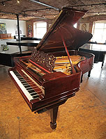An 1889, Steinway Model B grand piano with a rosewood case, filigree music desk and spade legs.
