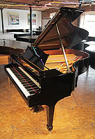 A 1929, Steinway Model O grand piano with a black case and spade legs