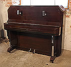Piano for sale. A Barker upright piano with an Art Deco style, mahogany case. Cabinet features strong angular styling and chrome fittings.