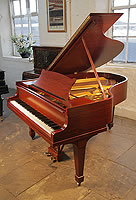 A 1926, Steinway Model M grand piano with a mahogany case and spade legs