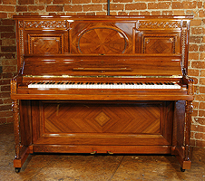 A rebuilt, 1912, Steinway Vertegrand Upright Piano For Sale with a Quartered, Walnut Case and Fluted, Sheraton Style Legs. Cabinet Features Ornate Carvings of Strapwork and Beading. 