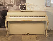 Piano for sale. A 1968, Hornung and Moller upright piano with a Louis XV, Rococo style case. Cabinet features gold ornament of flowers and scrolling lines and cabriole legs