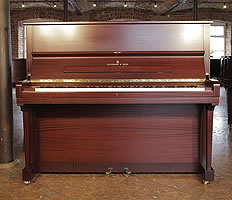 A 1980, Steinway Model V upright piano with a mahogany case.