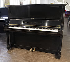  1943, Bechstein model 8 upright piano with a polished, black case