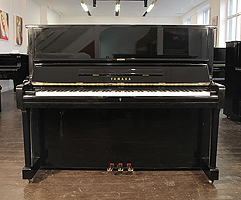 A 1991, Yamaha U10A upright piano with a black case and polyester finish