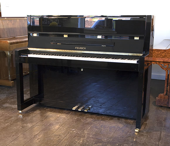 Brand New, Feurich Model 115 upright Piano for sale with a black case.