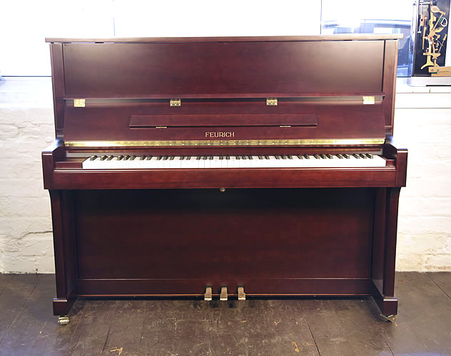 Brand New, Feurich Model 122 upright Piano for sale with a mahogany case.