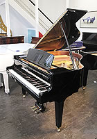 A 2017, Kawai GE20 baby grand piano for sale with a black case and square, tapered legs.