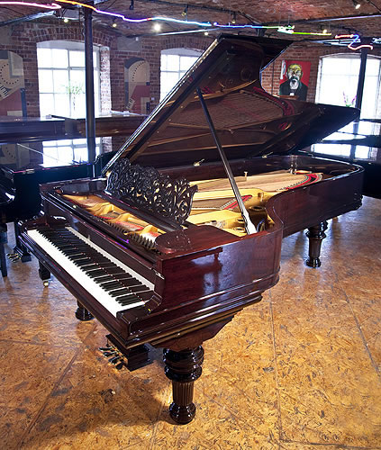 An 1886, Steinway & Sons Model D concert grand piano with a rosewood case, filigree music desk and turned, fluted legs