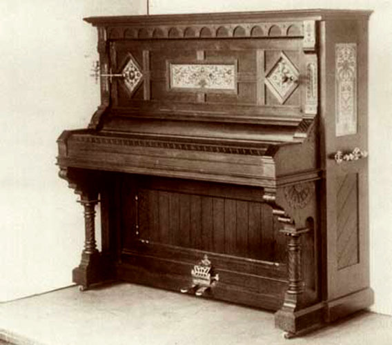 Photo of this English Gothic Ibach piano model from the Ibach website.