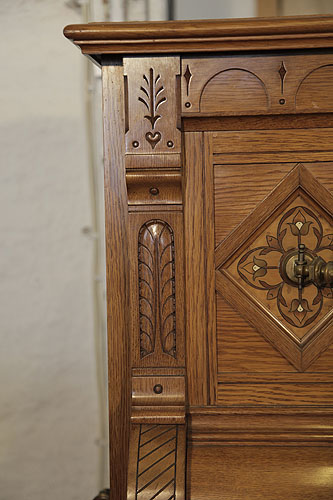 Ibach carved pilaster featuring carved folk art elements including a heart and stylised trees