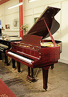 A pre-owned, Royale DG-1 baby grand piano with a mahogany case and polyester finish