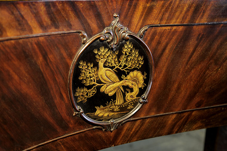Schiedmayer plaque of a Chinese scene of a bird perched on a branch in embossed, black and gold Japanning