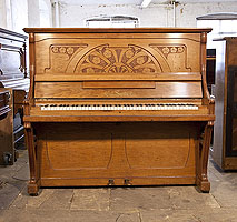 Seiler upright piano for sale with an Art Nouveau style walnut case. Cabinet features a front panel carved with stylised poppies 