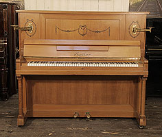 Artcased, 1911, Seiler upright piano for sale with a walnut case and two turned, column legs. Cabinet inlaid with contrasting ebony with stylised flowers, swags and bows