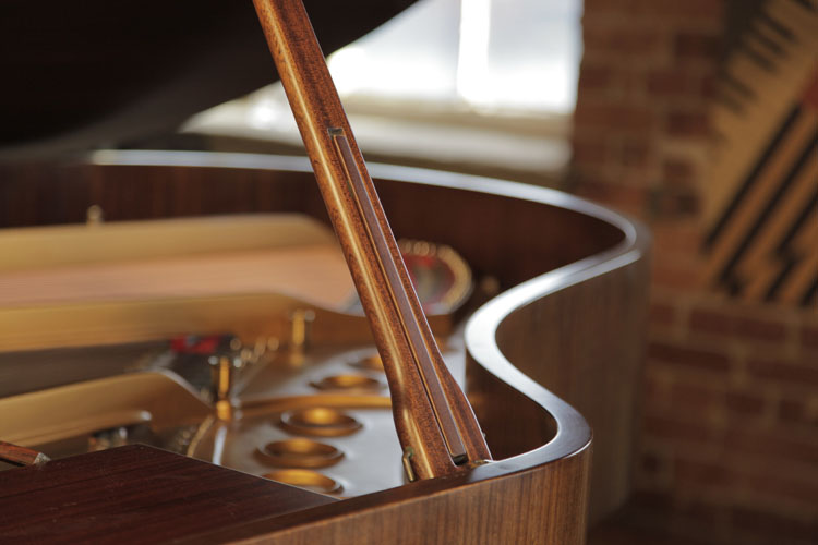 Steinway prop stick features an indented half prop so the lid can be open at differing heights