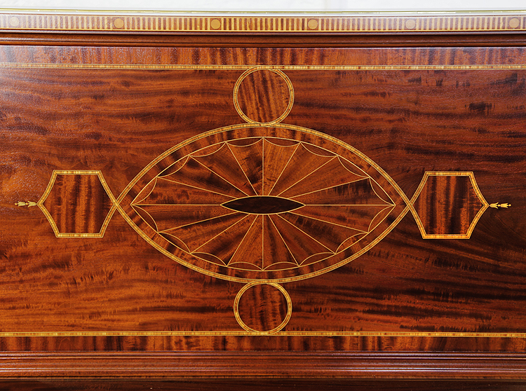 Weber front panel inlay detail featuring geometric forms in a variety of woods.