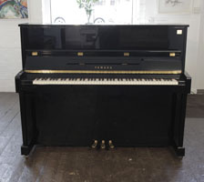 Reconditioned,  Yamaha ET121 upright piano for sale with a black case and brass fittings