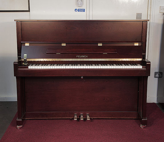 Brand New, Feurich Model 122 upright Piano for sale with a satin, walnut case.