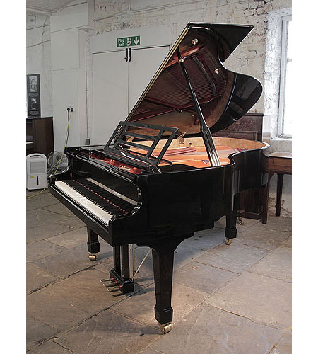 Preowned, Feurich Model 178 Professional grand piano with a black case and brass fittings.  Piano has an eighty-eight note keyboard and a three-pedal lyre.