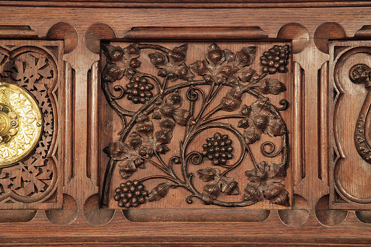 Gebruder Knake front panel featuring carvedvine leaves and grapes