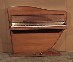 A Rippen upright grand piano with a polished, walnut case. The cabinet follows the sinuous line of the internal grand piano frame