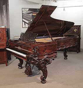 Rebuilt, 1874, Steinway & Sons Model D concert grand piano for sale with a rosewood case, filigree music desk and ornately carved, reverse scroll legs