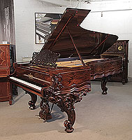 Rebuilt, 1874, Steinway & Sons Model D concert grand piano for sale with a rosewood case, filigree music desk and ornately carved, reverse scroll legs.