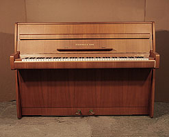 A 1965, Steinway Model F upright piano with a polished, walnut case