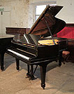 Piano for sale. A 1926, Steinway Model O grand piano with a black case and spade legs. Piano has an eighty-eight note keyboard and a two-pedal lyre. 