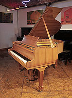 A 1966, Steinway Model S baby grand piano with a book-matched walnut case and spade legs 