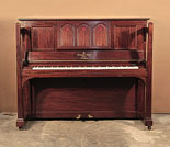 Piano for sale. Arts and Crafts style, 1905, Steinway upright piano for sale with a figured, mahogany case and large sculptural legs. Cabinet features a music desk in a three arch design with cut-out inverted hearts backed with red felt.
