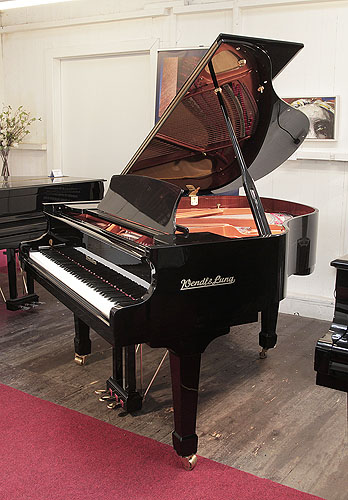 A pre-owned, Wendl and Lung Model 161 grand piano with a black case and polyester finish. 