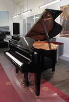 A 2012, Yamaha GB1 baby grand piano for sale with a black case and square, tapered legs. Piano has an eighty-eight note keyboard and a three-pedal lyre.
