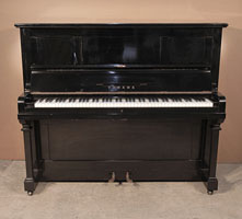 Reconditioned,  1962, Yamaha U2 upright piano with a black case and brass fittings