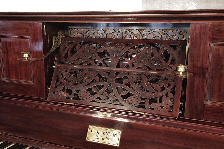 Bechstein pull-out, openwork piano music desk in a stylised design of birds and foliage.