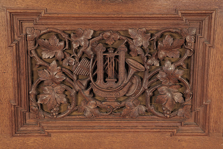 Biese Hof front panel carved with foliage and musical instruments in high relief